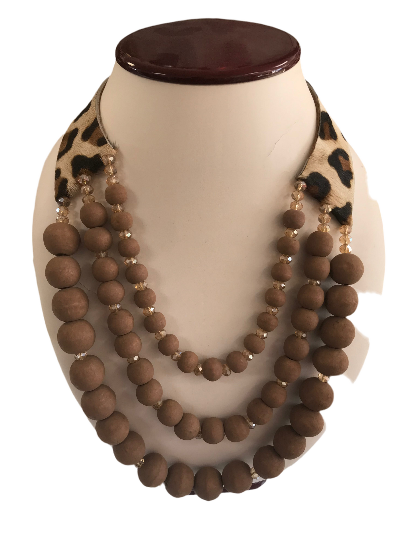 Multi layered wood necklace with faux leopard collar.