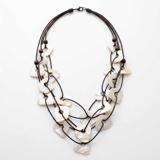 Model wearing the white Kabbi shell necklace and both matching earrings
