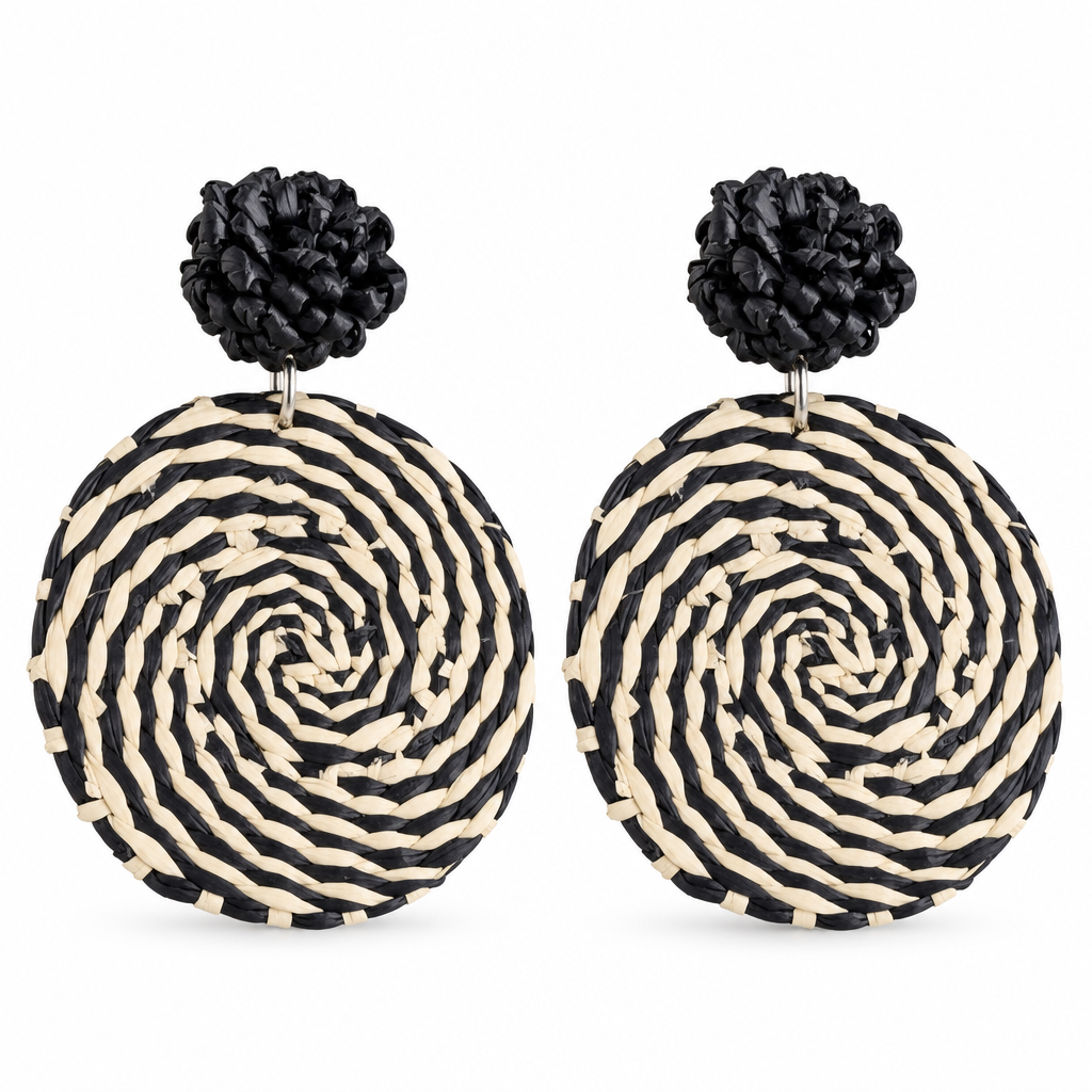 Matching pair of black-and-cream woven earrings on a white background
