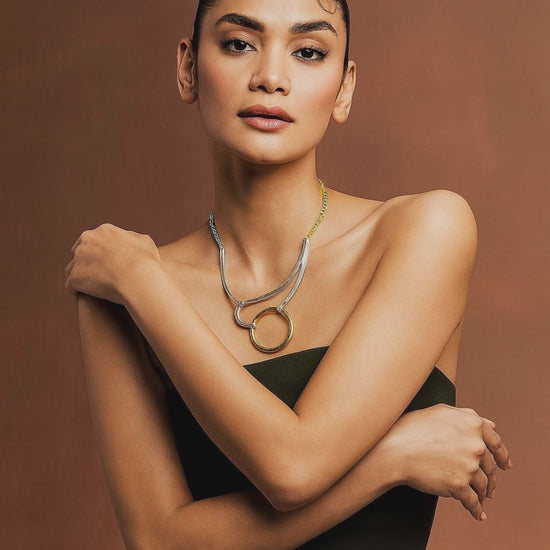 Elegant gold and silver station necklace designed by Karine Sultan