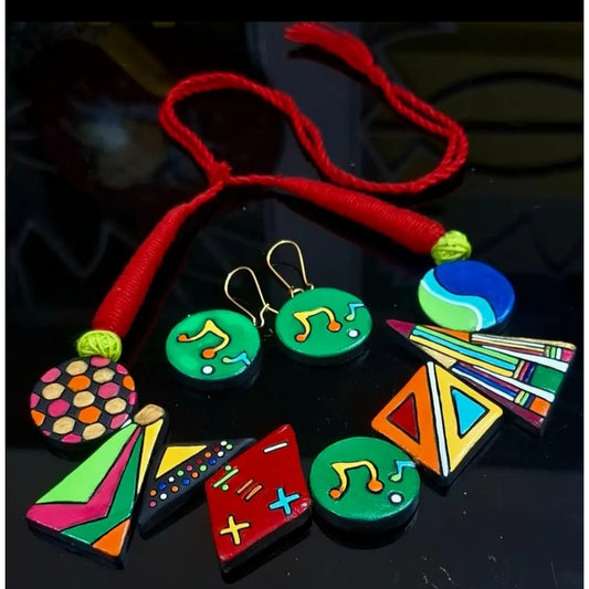 Colorful necklaces and earrings on a dark background