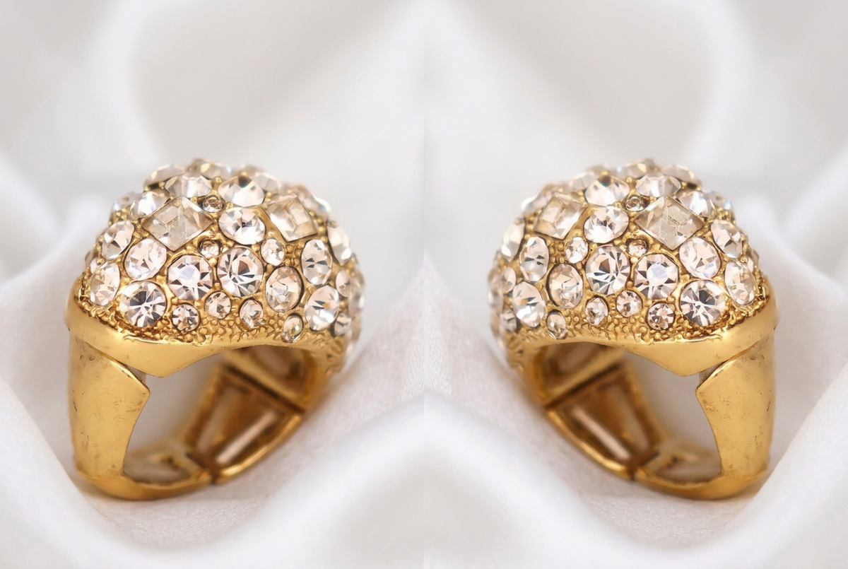 Two side-by-side views showing the left and right sides of the Maxi dome ring on white silk