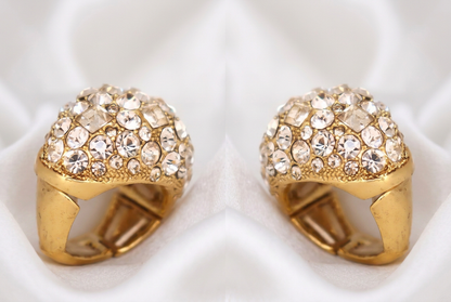 Two side-by-side views showing the left and right sides of the Maxi dome ring on white silk